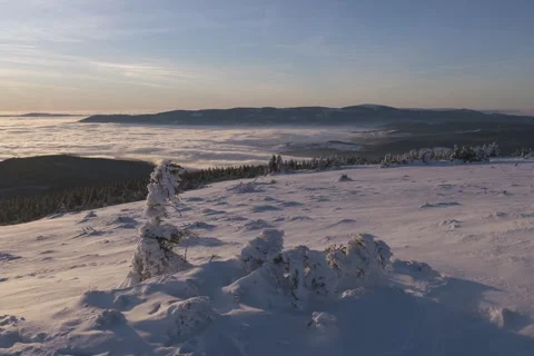 8K Winter sunset mountains with low clouds Stock Footage 255965372