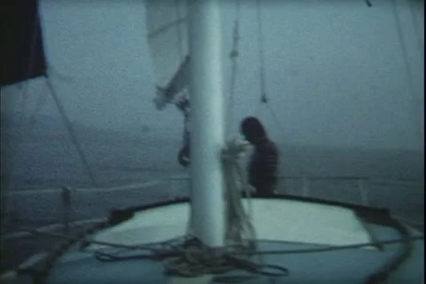 8mm archive-man on sailboat Stock Footage 20472553
