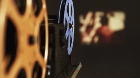 8mm Film Projector plays old movie rack from reel to reel Stock Footage