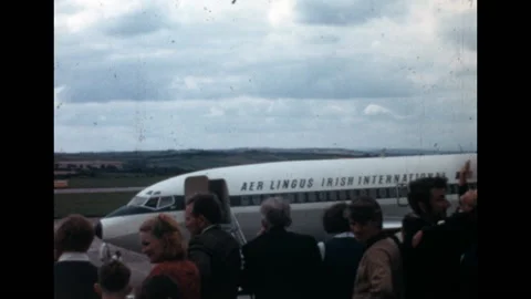 8MM - IRELAND - Aer Lingus aircraft and passengers on the tarmac - Dublin - 1971 Stock Footage