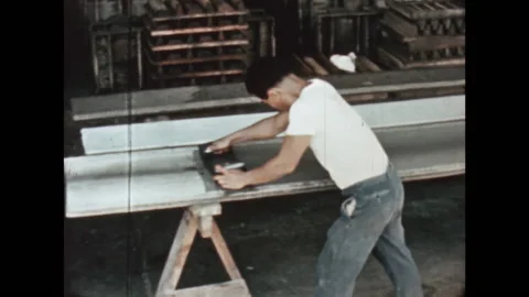 8MM - PHILIPPINES - worker applying asbestos to an eternit element - Manila 1965 Stock Footage 167683008