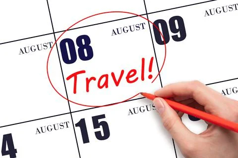 8th day of August. Hand drawing a red circle and writing the text TRAVEL on t Stock Photos