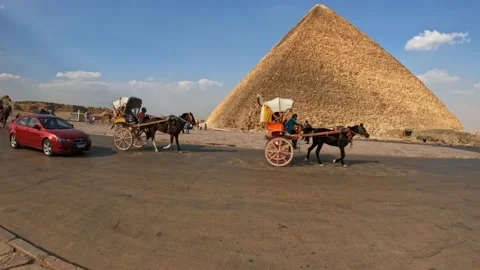 8th october 2022, Egypt pyramids of giza walking towards the pyramids in a busy Stock Footage 219345023