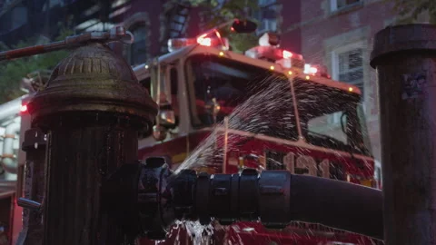 9-20-26, Brooklyn, NY, USA - dusk fire hydrant in front of flashing firetruck Stock Footage 346107579