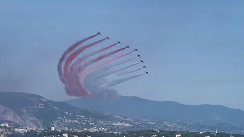 9 Acrobatic Red Arrows Jets, shoot the monaco colors over the monaco yacht sh Stock Footage 100259737