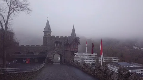 9 | APPROACHING GATE ON MYSTICAL CASTLE IN COCHEM SET IN FOG | AERIAL Stock Footage