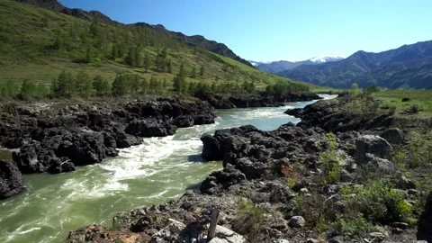 9 river in the mountains, steep and rocky shore, early spring in the mountai Stock Footage 264104136