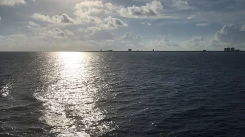 9 Second clip horizon calm seas sun reflecting on water surface Stock Footage 96518375