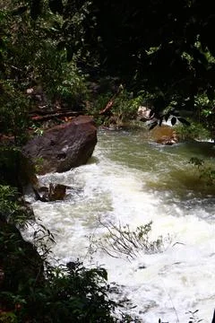 9 Steps Waterfall Flowing Through Lush Tropical Jungle in Kampot, Cambodia Stock Photos