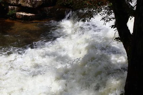 9 Steps Waterfall Flowing Through Lush Tropical Jungle in Kampot, Cambodia Stock Photos