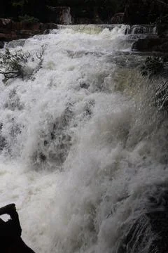9 Steps Waterfall Flowing Through Lush Tropical Jungle in Kampot, Cambodia Stock Photos