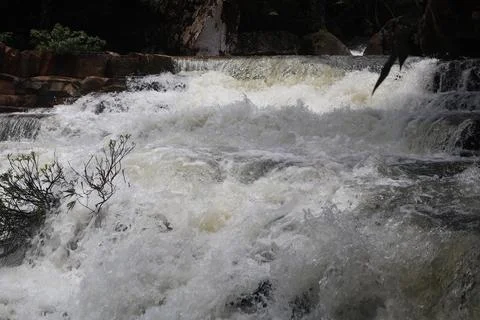 9 Steps Waterfall Flowing Through Lush Tropical Jungle in Kampot, Cambodia Stock Photos