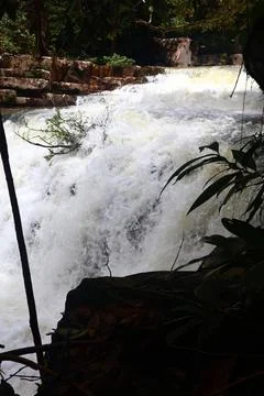 9 Steps Waterfall Flowing Through Lush Tropical Jungle in Kampot, Cambodia Stock Photos