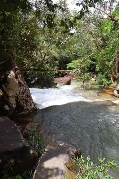 9 Steps Waterfall Flowing Through Lush Tropical Jungle in Kampot, Cambodia Stock Photos
