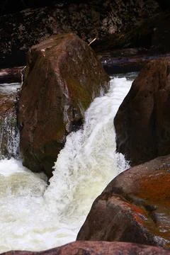 9 Steps Waterfall Flowing Through Lush Tropical Jungle in Kampot, Cambodia Stock Photos