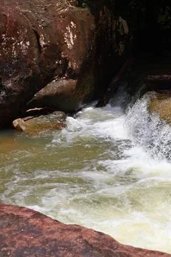 9 Steps Waterfall Flowing Through Lush Tropical Jungle in Kampot, Cambodia Stock Photos