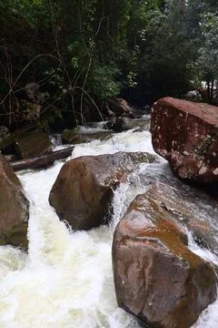 9 Steps Waterfall Flowing Through Lush Tropical Jungle in Kampot, Cambodia Stock Photos
