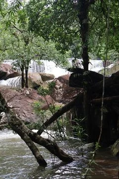 9 Steps Waterfall Flowing Through Lush Tropical Jungle in Kampot, Cambodia Stock Photos