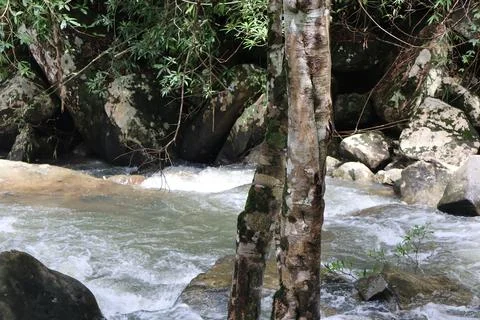 9 Steps Waterfall Flowing Through Lush Tropical Jungle in Kampot, Cambodia Stock Photos