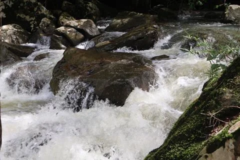 9 Steps Waterfall Flowing Through Lush Tropical Jungle in Kampot, Cambodia Stock Photos
