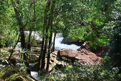 9 Steps Waterfall Flowing Through Lush Tropical Jungle in Kampot, Cambodia Stock Photos