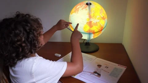 9-year-old elementary school boy doing homework - doing school-given math exerci Video stock 245636374
