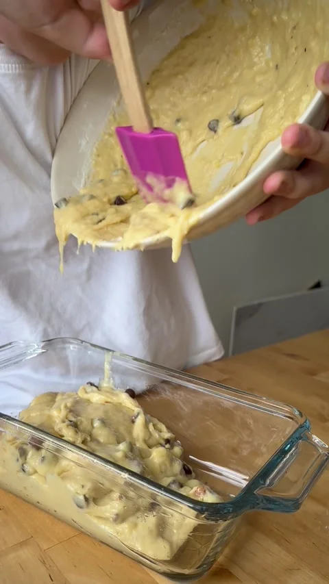 9 years old boy and 1 years baby preparing  a banana cake. Stock Footage 274656481