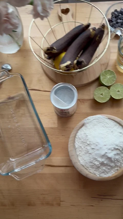 9 years old boy and 1 years baby preparing  a banana cake. Stock Footage 274656598