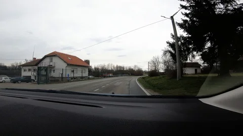 905-06 Car Ride Passenger View Drive Trough Village Stock Footage 106916880