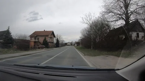 908-05 Car Ride Passenger View Drive Trough Village Time lapse Stock Footage 106915995