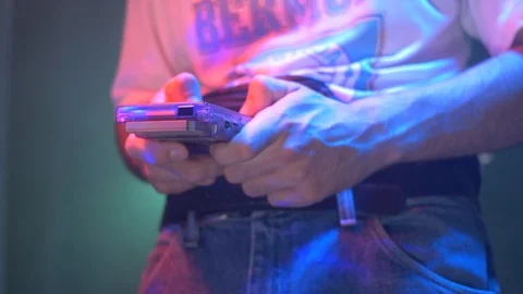 90s Using a Portable Video Game Console To Play Games Retro Style 스톡 동영상 94833575