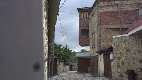 9/10 Old Street with Gothic Stone wall Town Houses in Azerbaijan. Slow Motion Stock Footage 248828885