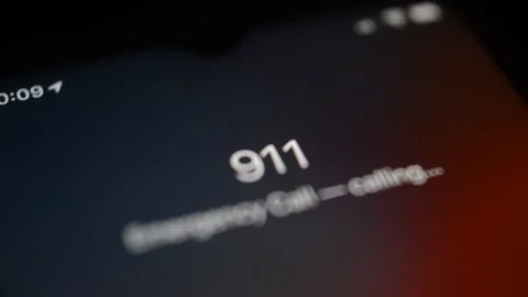 911 emergency number on iphone display on a dark blur background. Stock-Footage 254068007