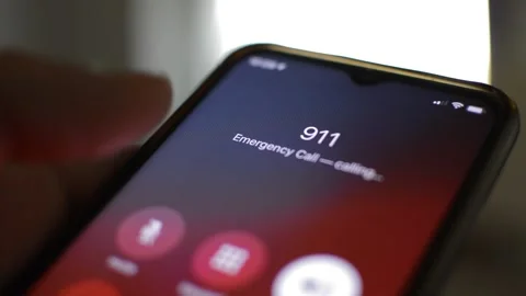 911 emergency number on the iphone screen. man call 911 number. 스톡 동영상 235989015