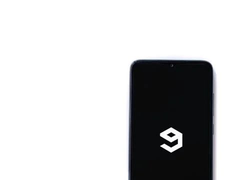 9GAG app launch screen with logo on the display of a black mobile smartphone  Stock Photos