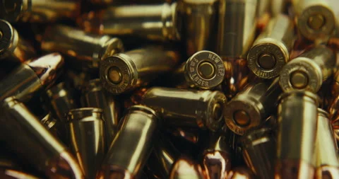 9mm bullets being grabbed and loaded into a magazine Stock Footage 279304363