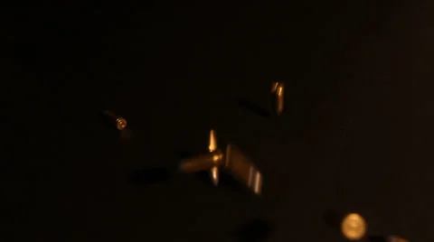 9mm Bullets Fall on Black Background Video stock 30443438