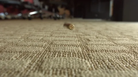 9mm Glock Shell Casing Falls to the Ground Stock Footage 95501137