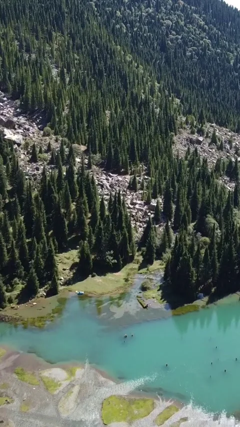9x16: Drone Pull Away From Lake And Camp. Kyrgyzstan, Suttuu-Bulak Lake. Stock-Footage 332787461