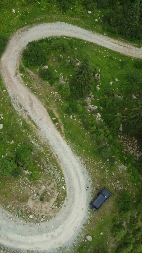9x16: Top-down Tracking Over Road And SUV. Kyrgyzstan, Karakol Stock Footage 332779284