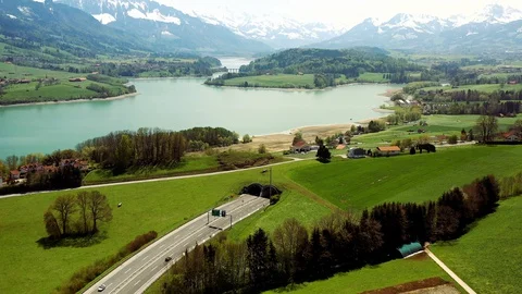 A12 motorway entering a tunnel at Lake of Gruyere, Switzerland Stock Footage
