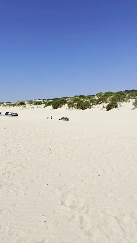 A2325 road surrounded by Wind-Formed Sand Dunes in Valdevaqueros Spain Stock Footage 311896749