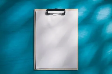 A4 clipboad on blue wood table Stock Photos