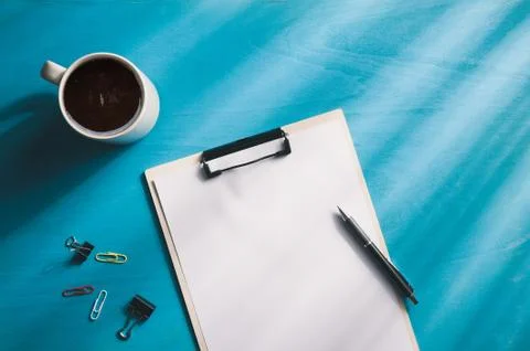 A4 clipboad on blue wood table Stock Photos