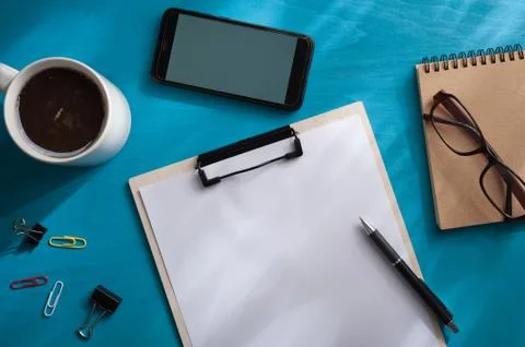 A4 clipboad on blue wood table Stock Photos