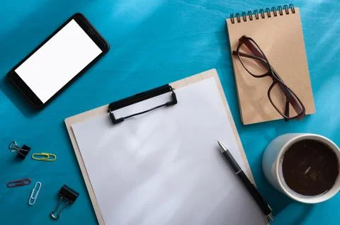 A4 clipboad on blue wood table Stock Photos