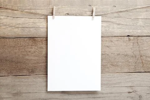 A4 mock up - empty sheet of paper on a wooden background - blank A4 sheet on Stock Photos