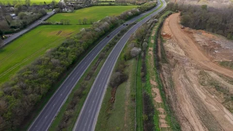 A414 reverse drone flight revealing Panshanger quarry and Hertfordshire Stock Footage 332991873