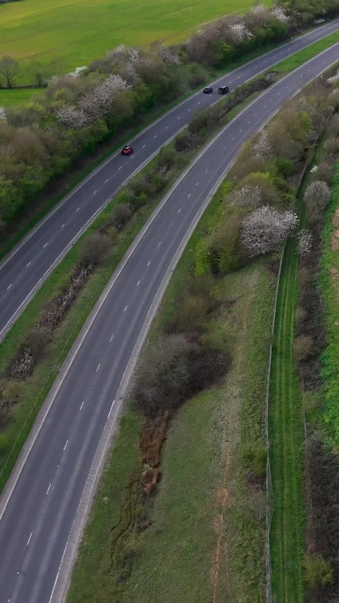 A414 reverse vertical drone flight revealing Panshanger quarry and Stock Footage 333013793