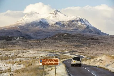The A835 to Ullapool looking towards Cul Mor in Assynt, Scotland, UK with fre Stock Photos